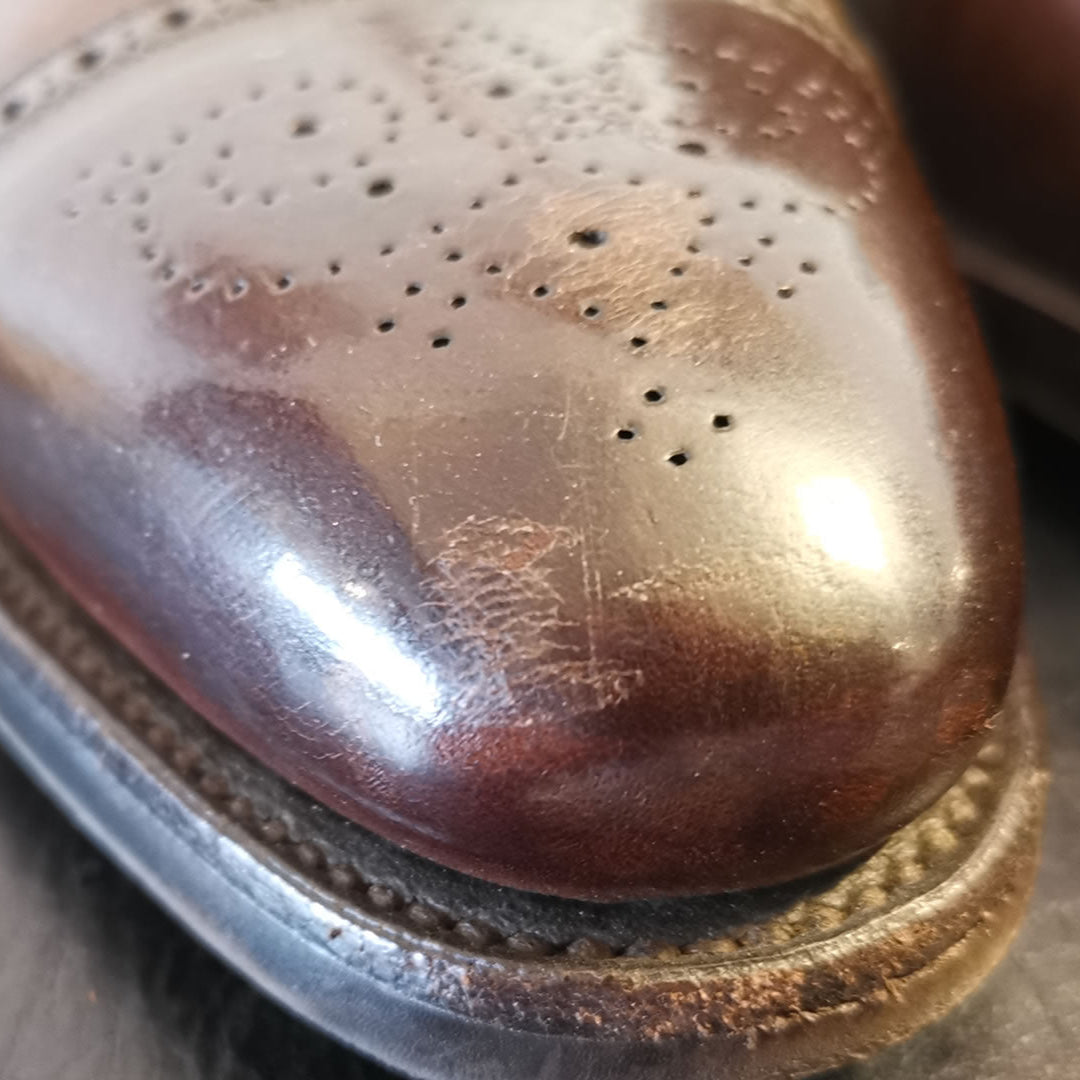 Scratched leather shoes